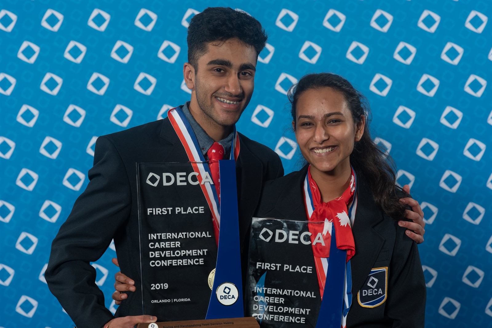 Turner Fenton DECA members holding first place trophies at ICDC